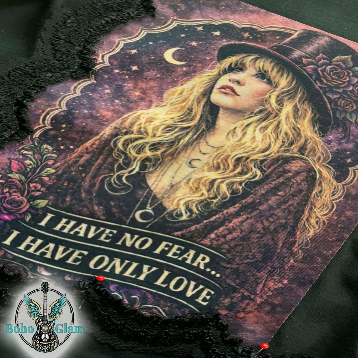 Artistic depiction of a woman with long hair and a hat, surrounded by decorative elements and text on a dark background.