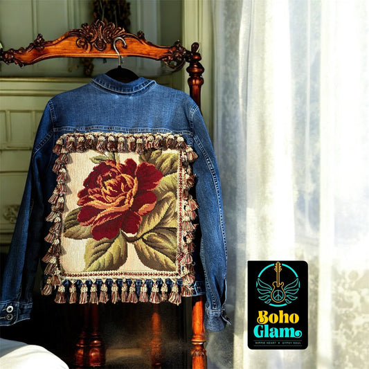 Blue denim jacket with floral tapestry design on a wooden chair, featuring 'Boho Glam' brand logo.