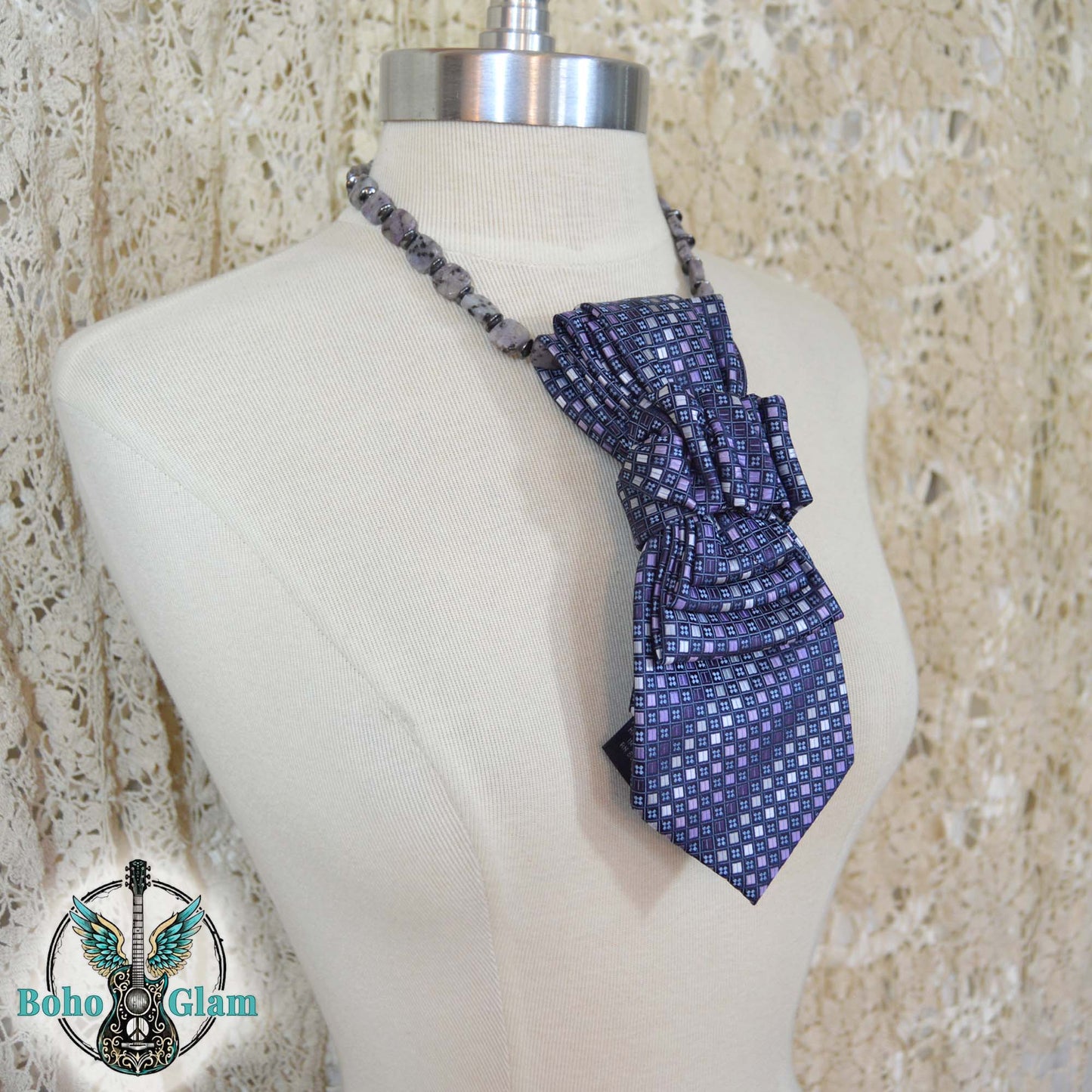 Blue patterned halter top on a mannequin with 'Boho Glam' logo in the corner.