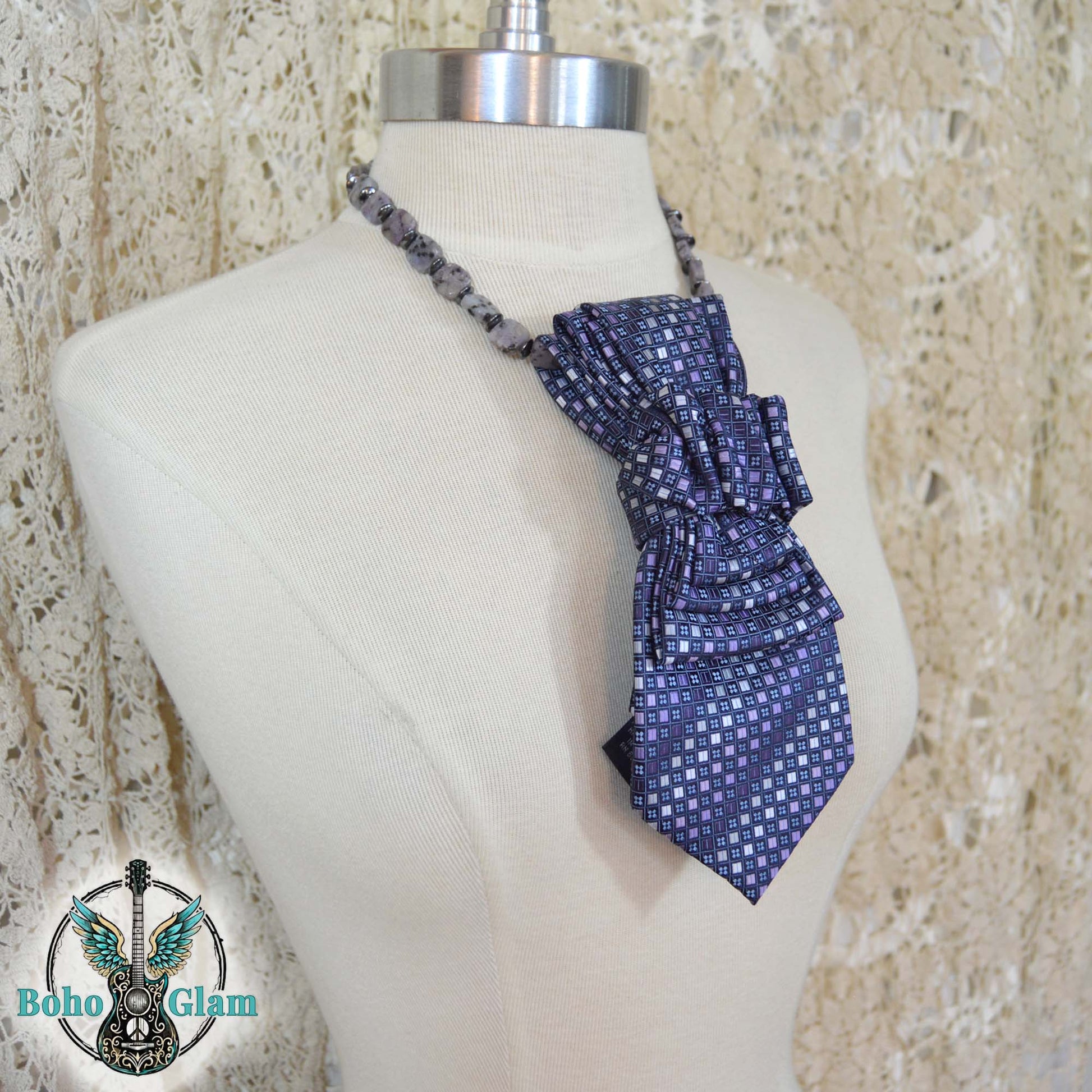 Blue patterned halter top on a mannequin with 'Boho Glam' logo in the corner.