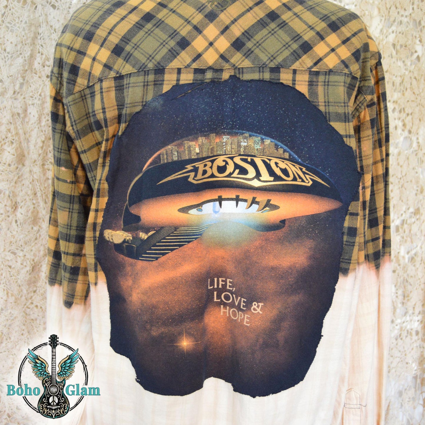 A close-up of the back graphic showing the Boston spaceship artwork and the words Life Love and Hope against the bleached fabric.