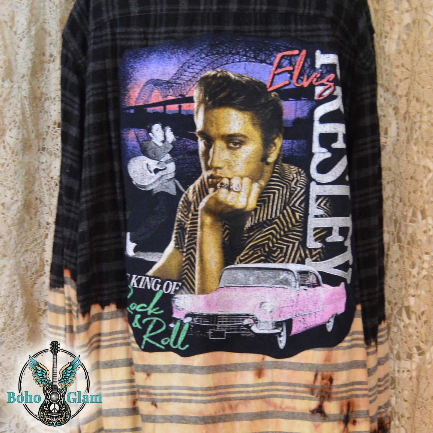 A black plaid flannel shirt with a bleached light bottom half and a large Elvis Presley graphic applique on the back