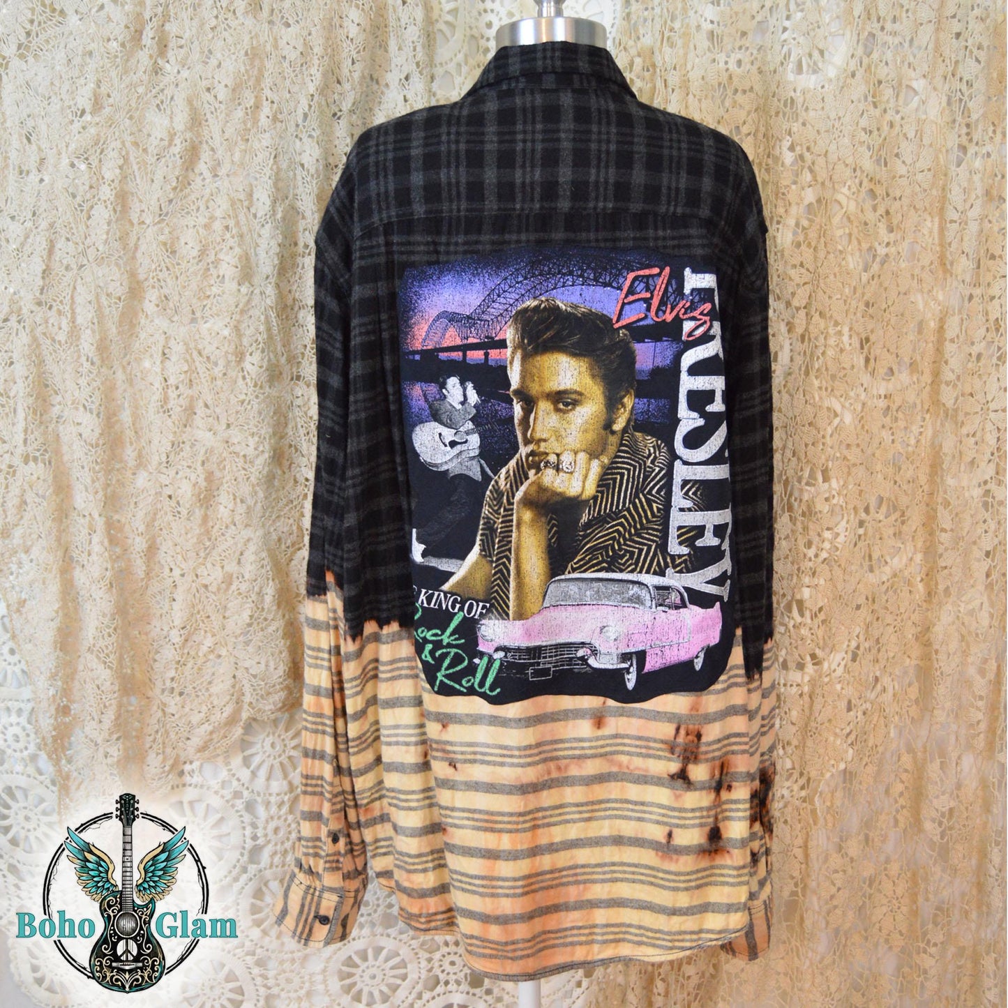 A black plaid flannel shirt with a bleached light bottom half and a large Elvis Presley graphic applique on the back
