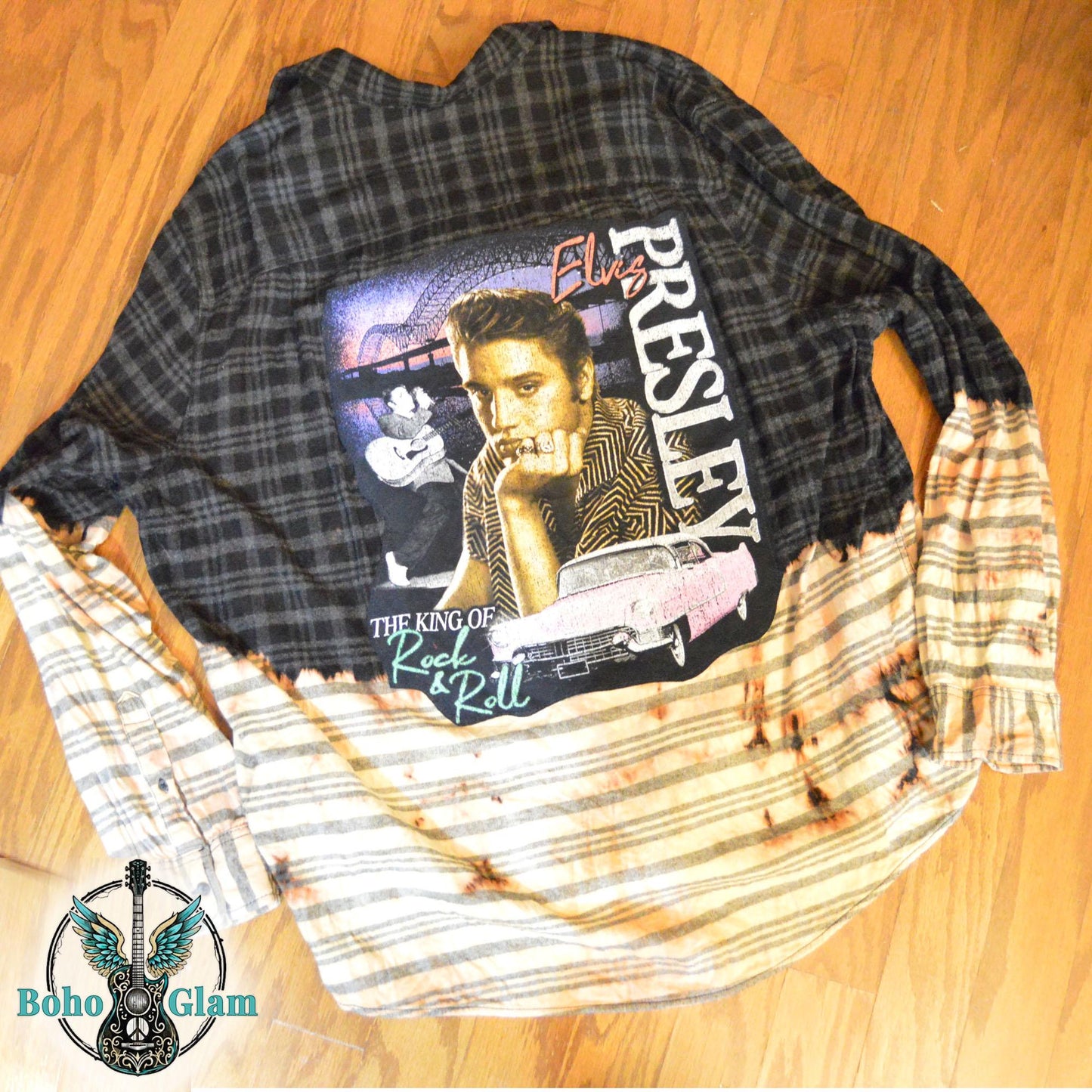 A black plaid flannel shirt with a bleached light bottom half and a large Elvis Presley graphic applique on the back