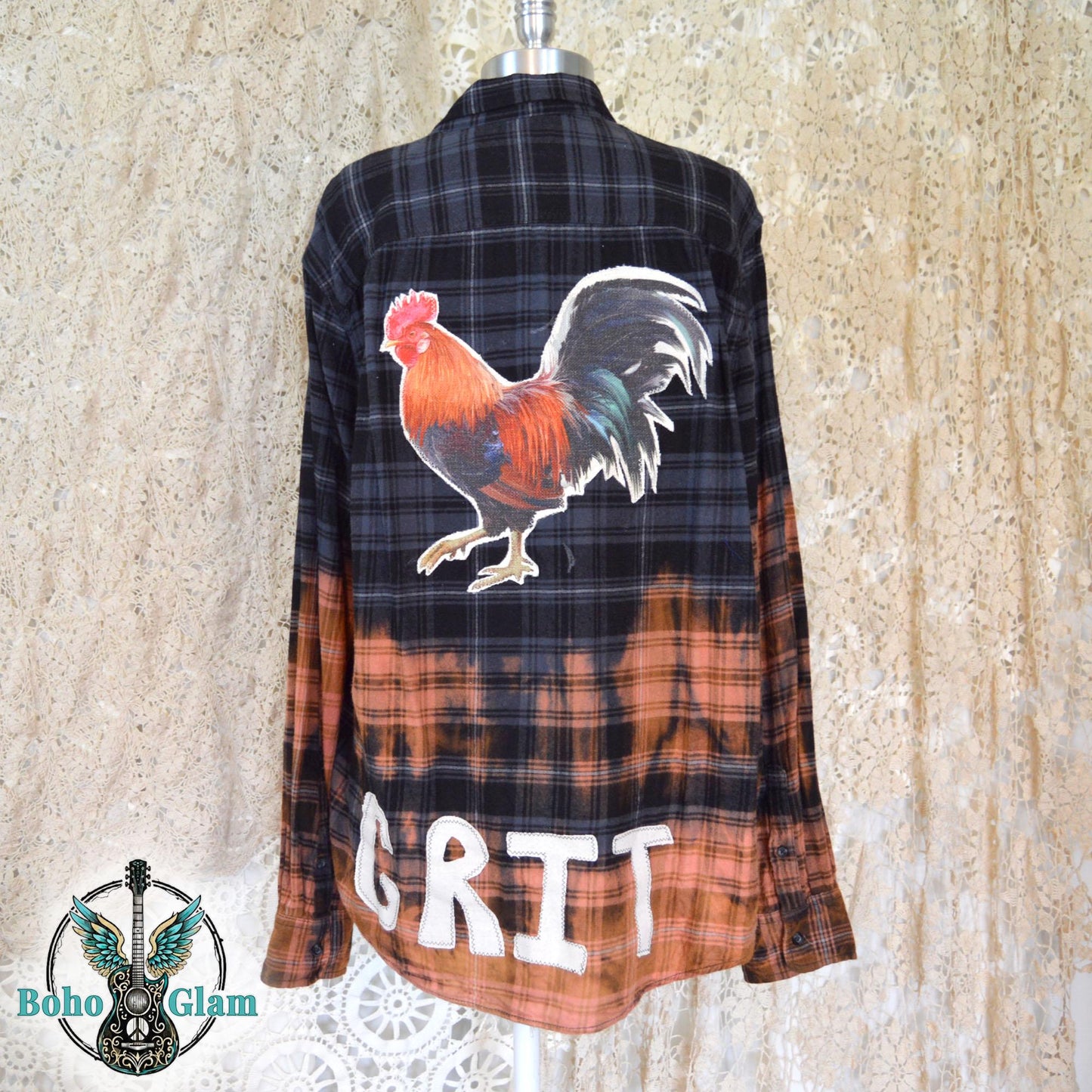 Rear of the bleached flannel featuring a large colorful rooster applique and white patchwork letters spelling GRIT along the hem.
