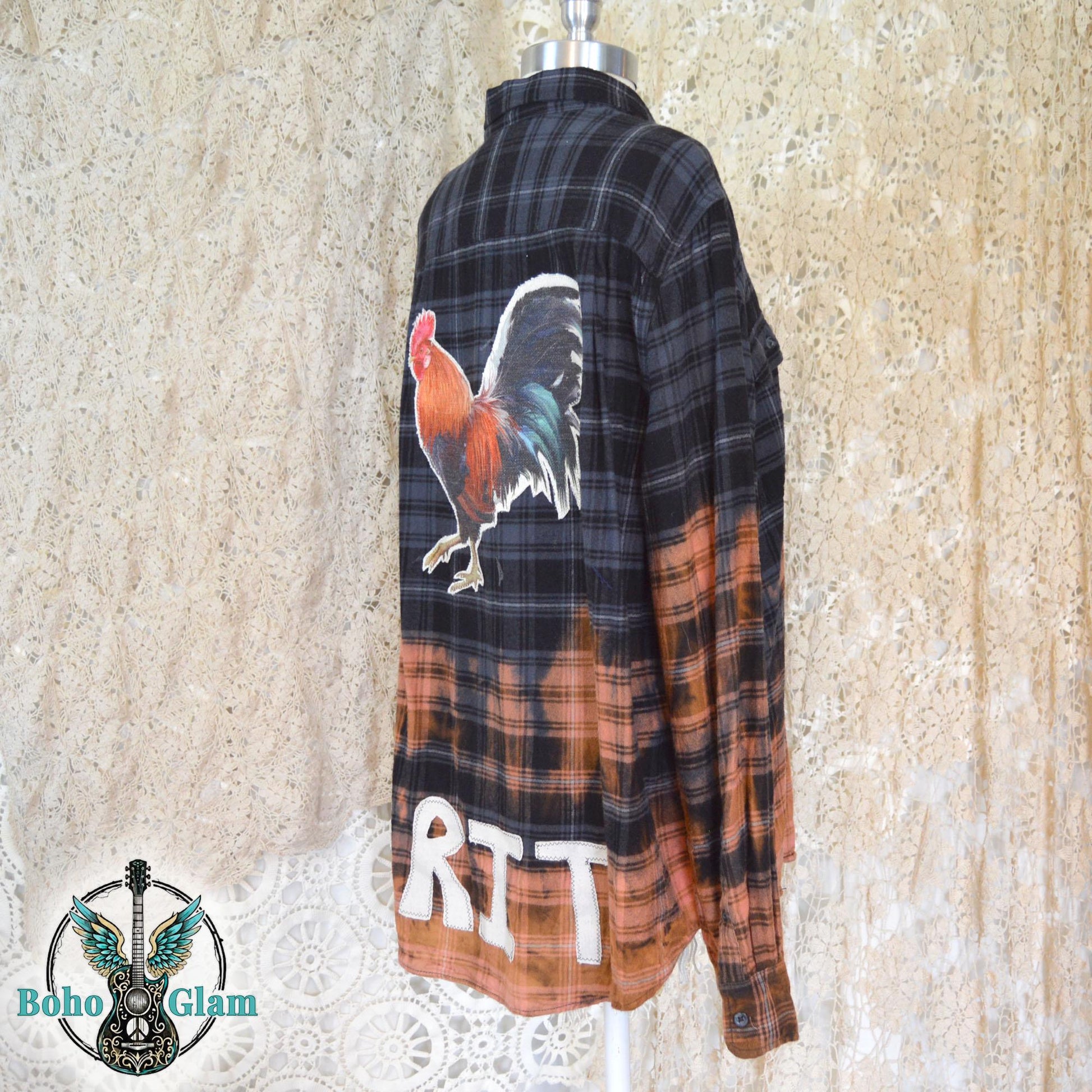 mannequin display showing the long sleeves and the striking color transition from dark charcoal plaid to bleached orange.