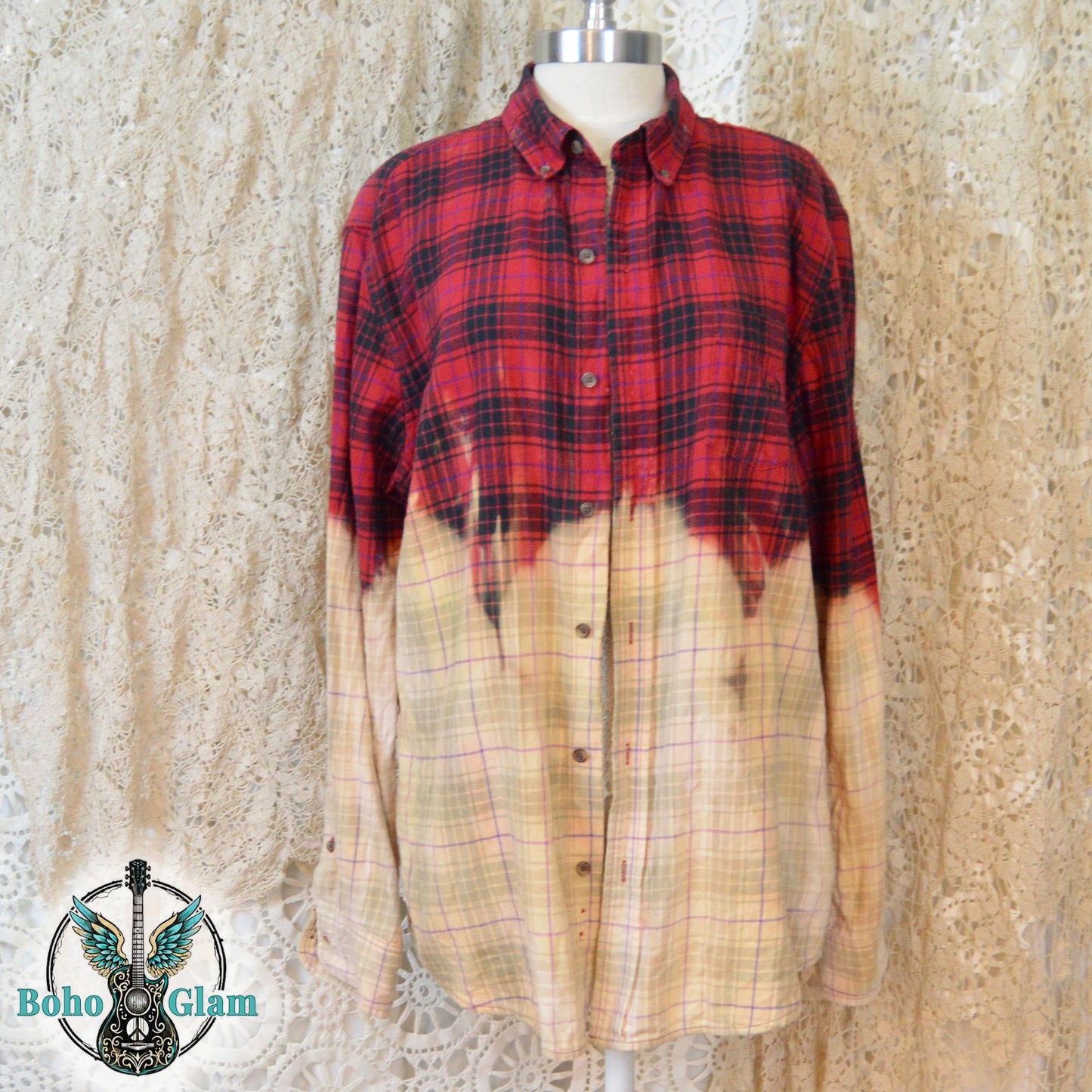 The front of the button-down flannel, showing the red plaid pattern across the chest and shoulders fading into a bleached cream grid pattern on the lower half.