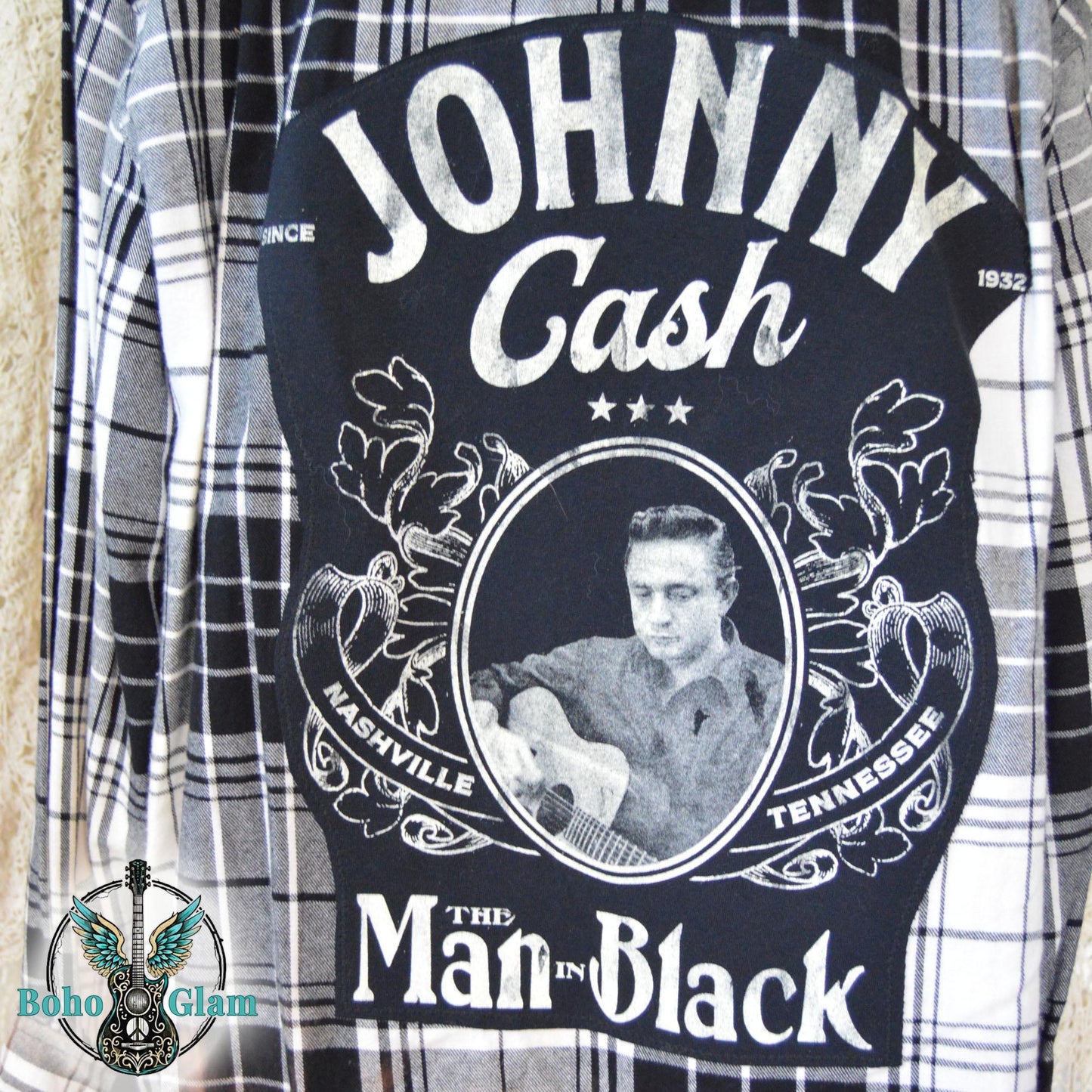 Graphic Detail: A close-up shot of the back of the shirt showing the detailed Johnny Cash Nashville Tennessee graphic with a photo of him playing guitar.