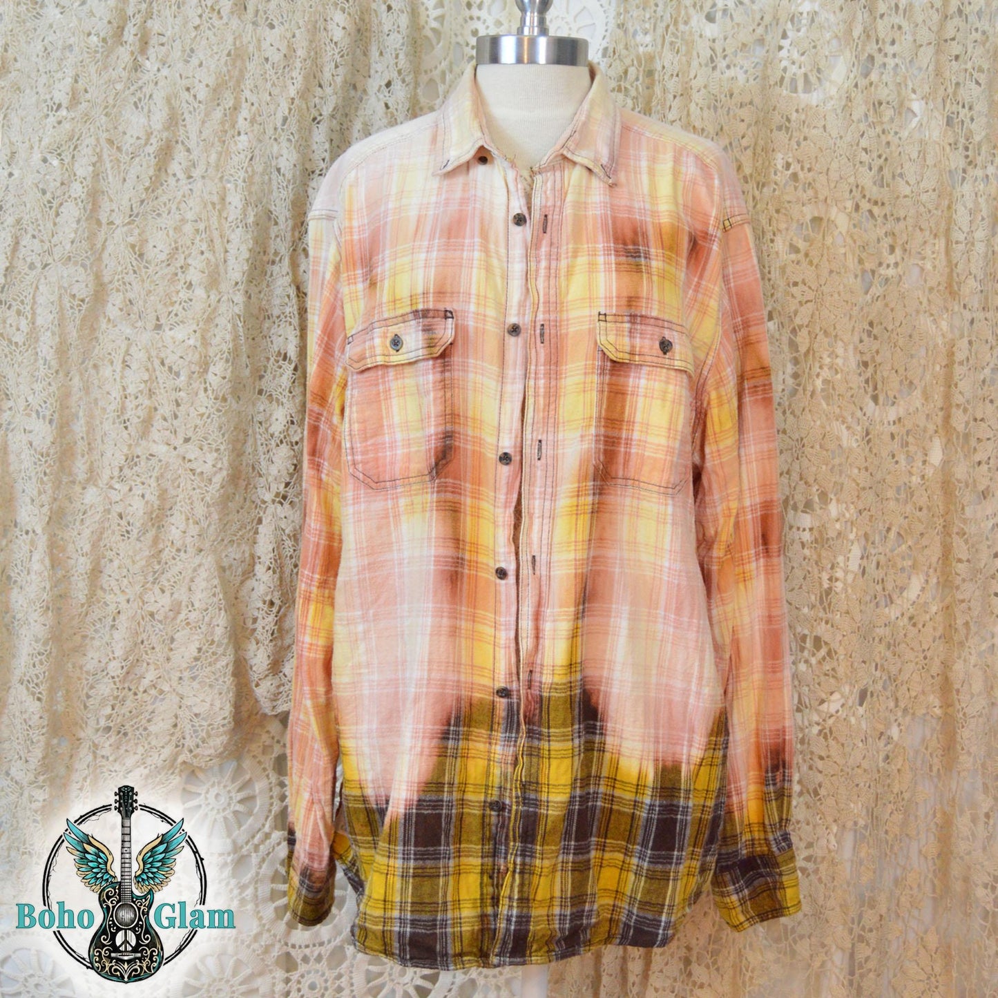 Front View: A Men's XL long-sleeved plaid shirt in peach and yellow tones with a prominent bleach-dipped effect along the bottom hem.