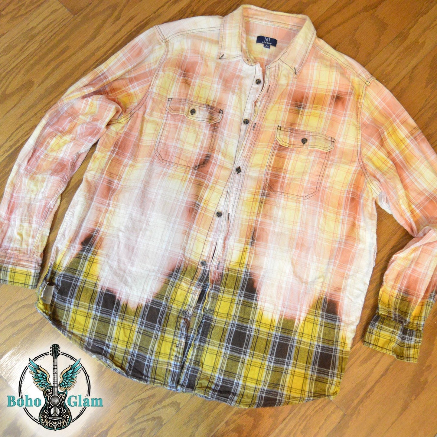 Front View: A Men's XL long-sleeved plaid shirt in peach and yellow tones with a prominent bleach-dipped effect along the bottom hem.