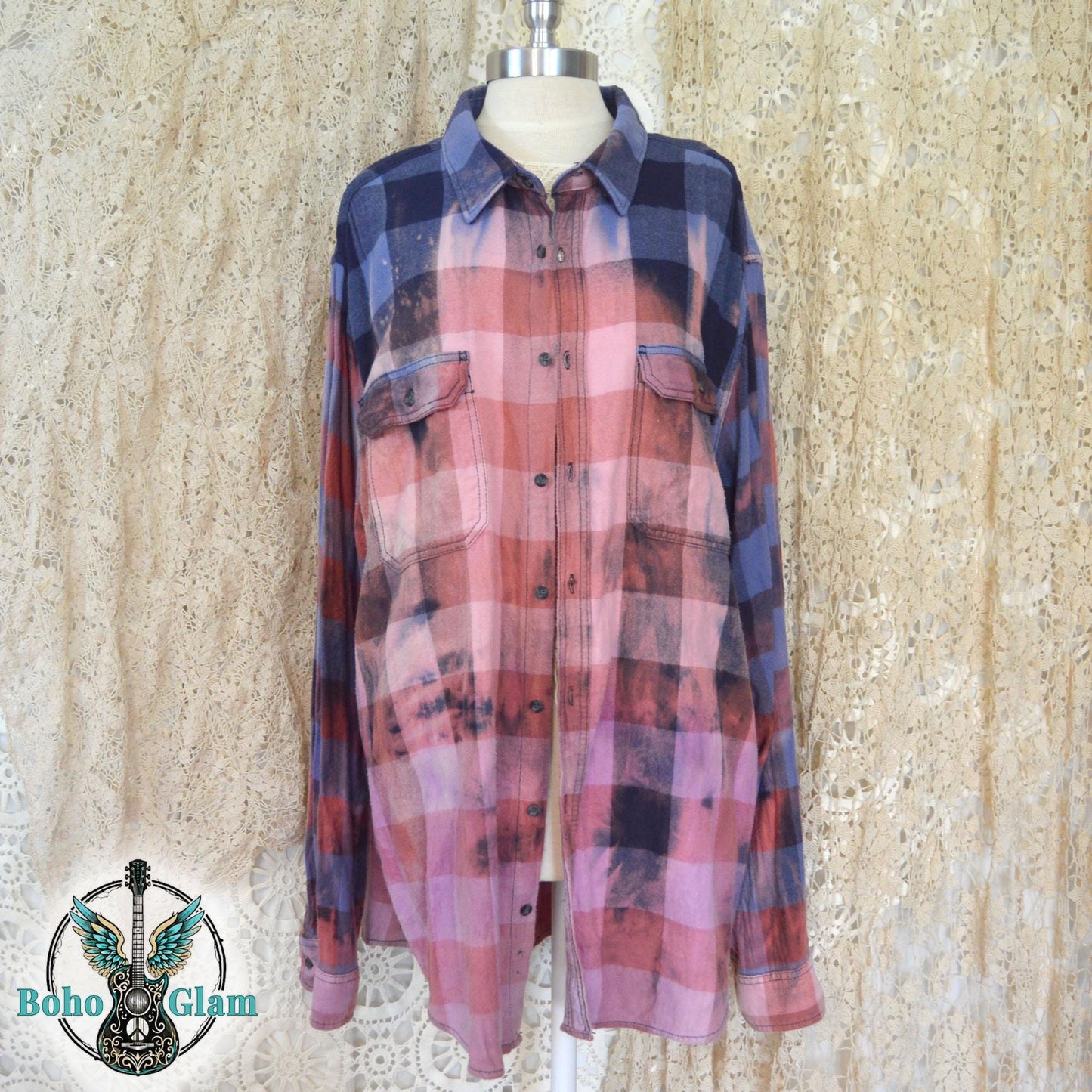 Front View on Mannequin: The long-sleeved button-down shirt shown on a mannequin, highlighting the sunset-pink bleached effect across the chest and torso.