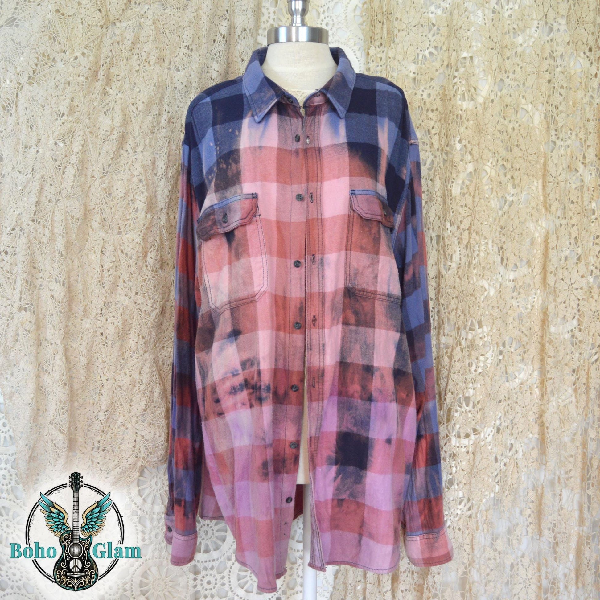 Front View on Mannequin: The long-sleeved button-down shirt shown on a mannequin, highlighting the sunset-pink bleached effect across the chest and torso.