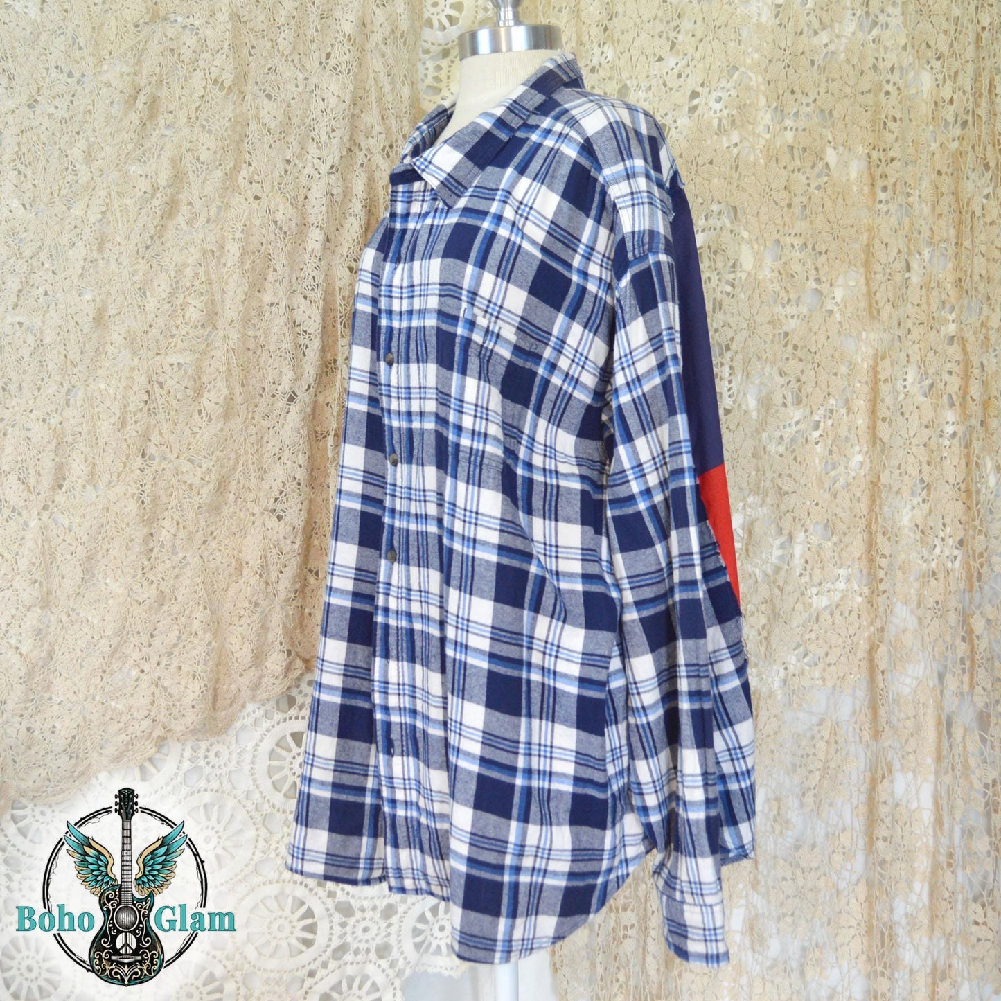 Side View on Mannequin: Profile shot showing the oversized fit of the flannel and the raw-edge stitching where the flag patch meets the plaid fabric.