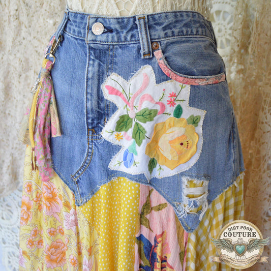 Close-up of a vintage floral placemat applique and a fabric-trimmed pocket on the light-wash denim base