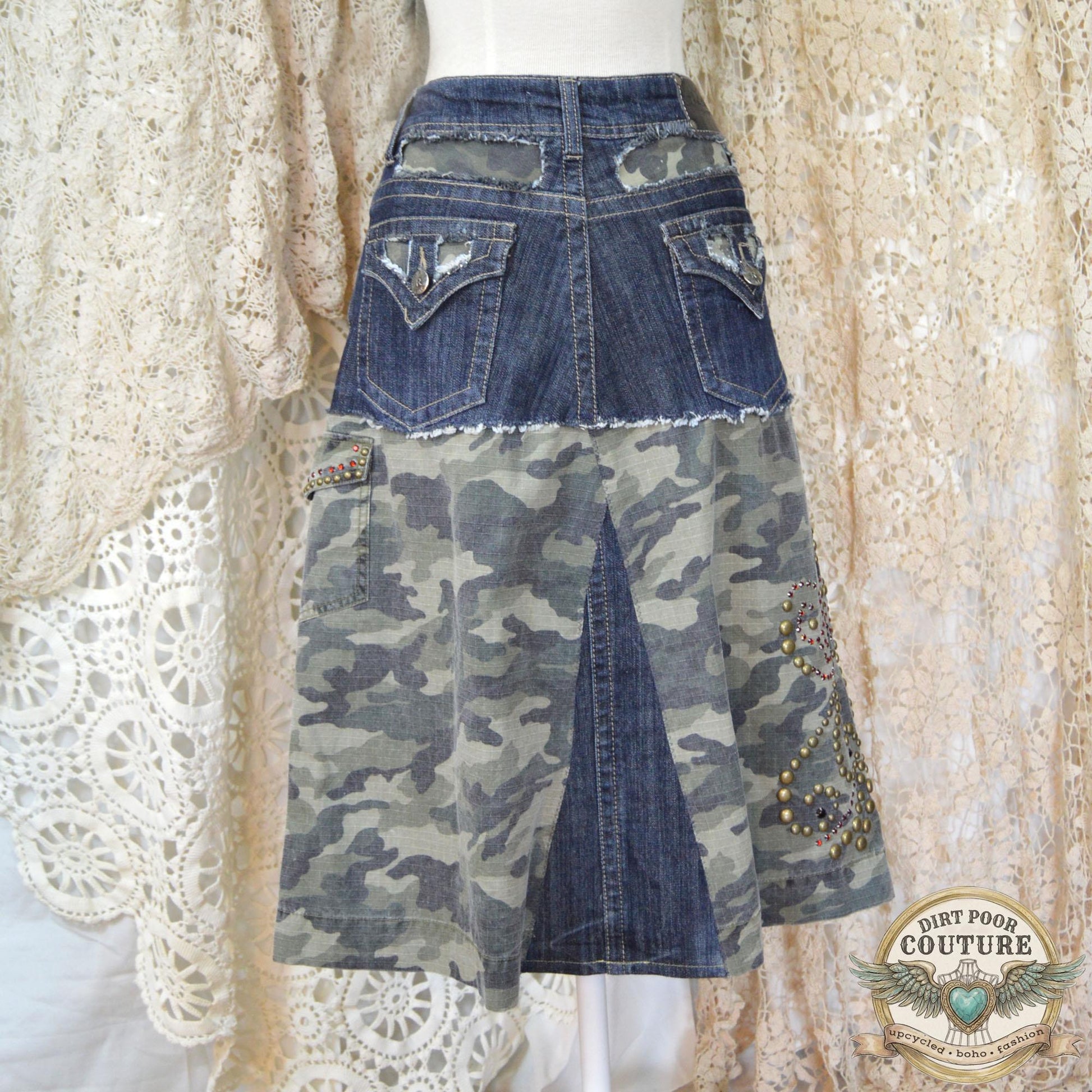 The back of the denim skirt showing the tailored fit and continuation of the camo accents and structural stitching.