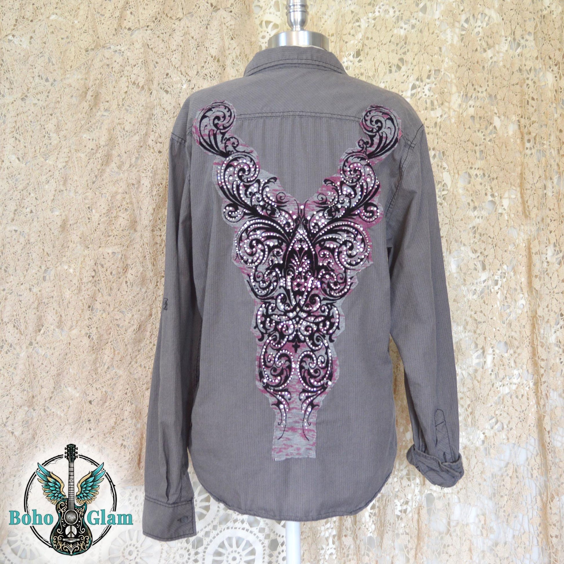 A charcoal gray corduroy button down shirt featuring a large pink and black filigree applique embellished with clear rhinestones.