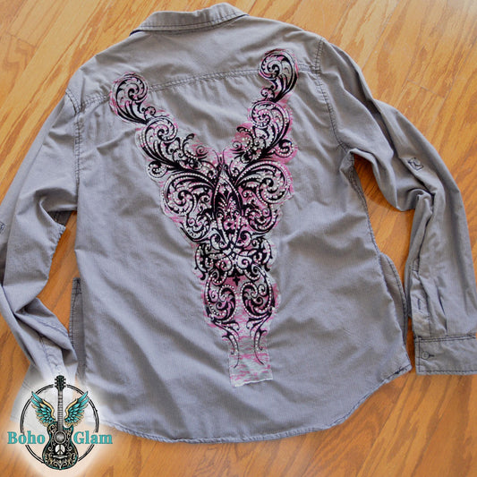 A charcoal gray corduroy button down shirt featuring a large pink and black filigree applique embellished with clear rhinestones.