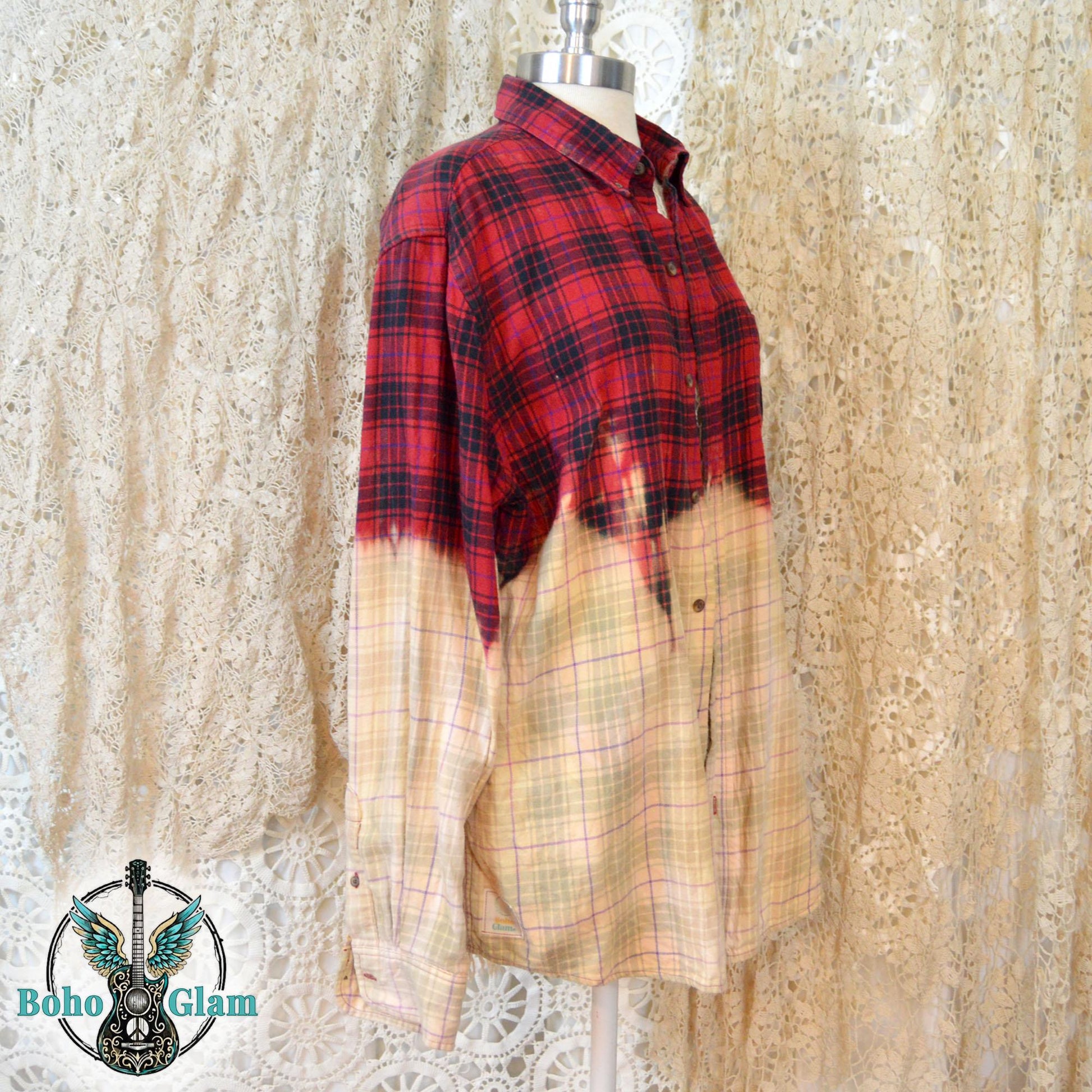 A profile shot of the shirt on a mannequin, showing the jagged, hand-dipped bleach line and the long sleeve with a button cuff.
