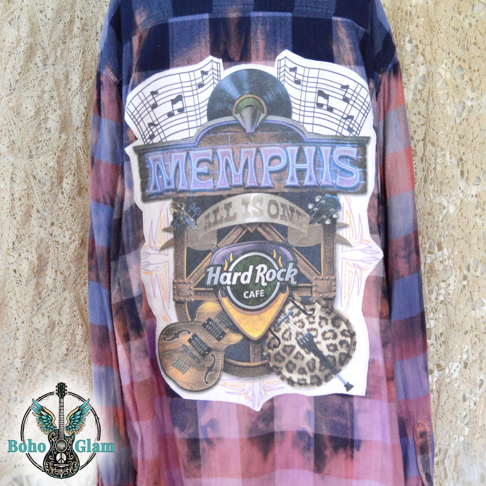 Graphic Detail: A close-up shot of the back patch featuring "Memphis," the Hard Rock Cafe logo, an acoustic guitar, and leopard print details.