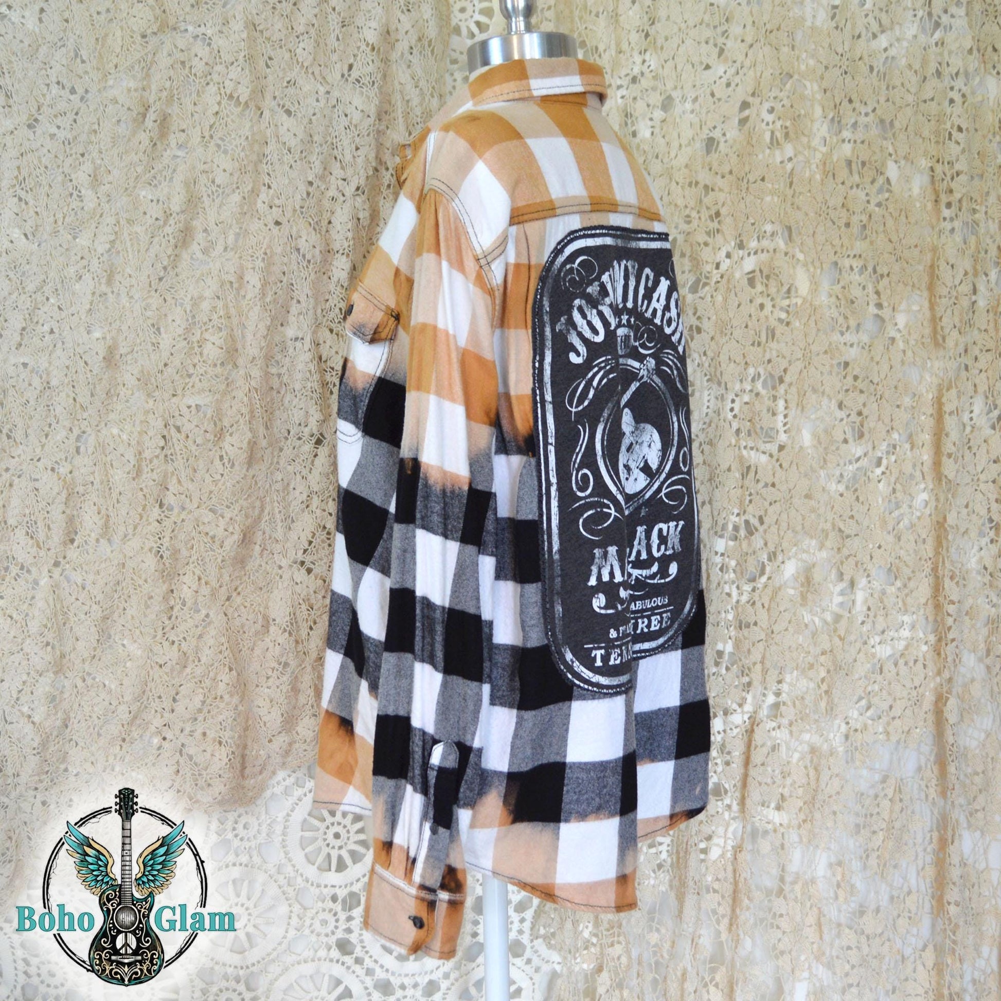 Side Profile: View of the upcycled shirt on a mannequin highlighting the sleeve length and the wraparound bleached effect on the side seam.