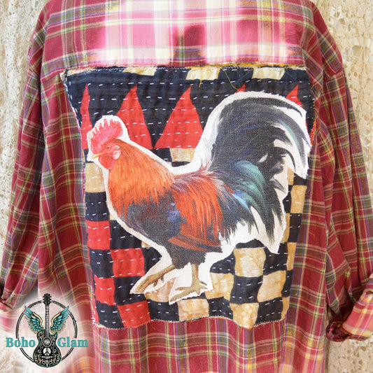 Applique Detail: A close up shot of the back applique featuring a colorful rooster on a kantha stitched patchwork background of black red and tan.