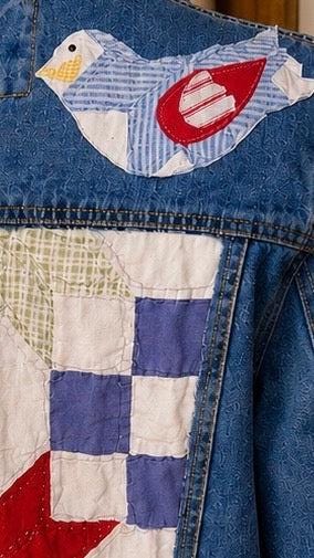 Close up of quilted bird back of denim jacket